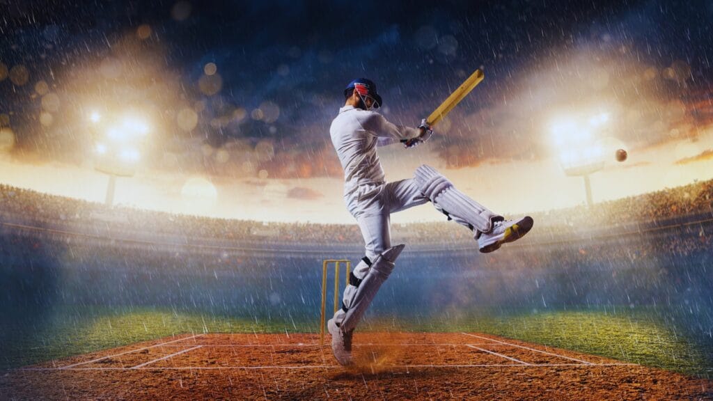 لاعب كريكيت محترف يستعد لضرب الكرة على أرضية ملعب بأقصى قوته